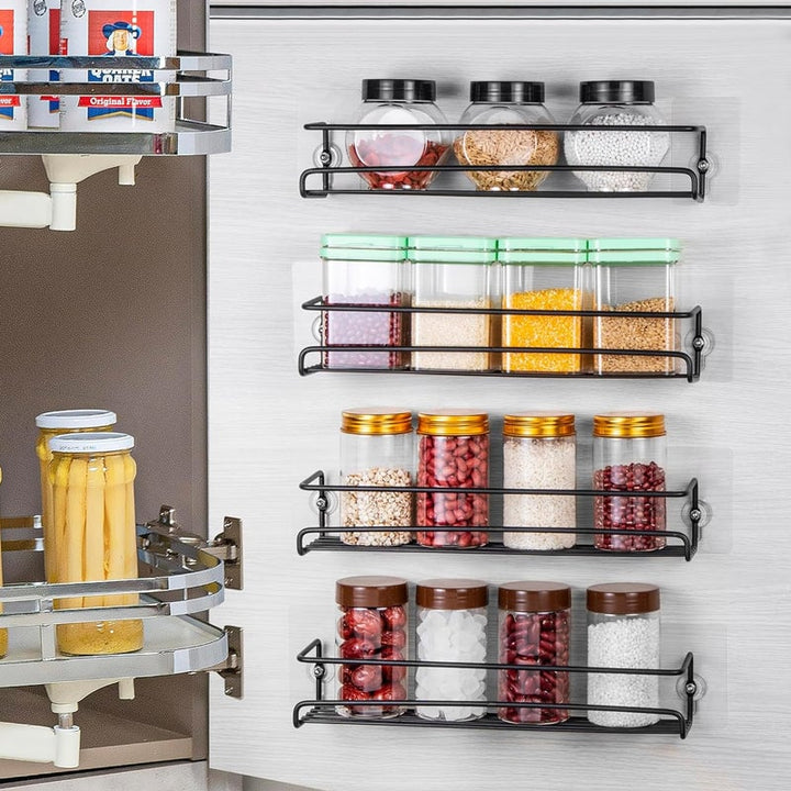 Wall-mounted carbon steel spice rack in a modern kitchen, showcasing organized jars.