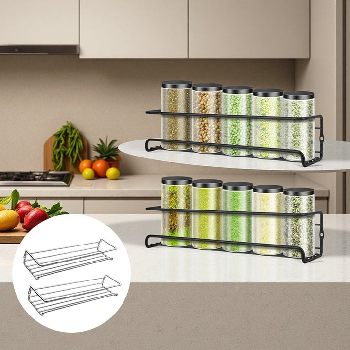 Stylish carbon steel spice rack with two tiers, mounted on a white kitchen wall, optimizing space.