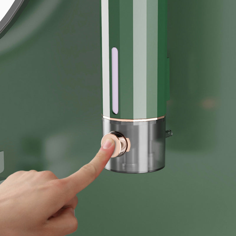 Compact wall mounted manual soap dispenser for small bathrooms or powder rooms, touch-free design