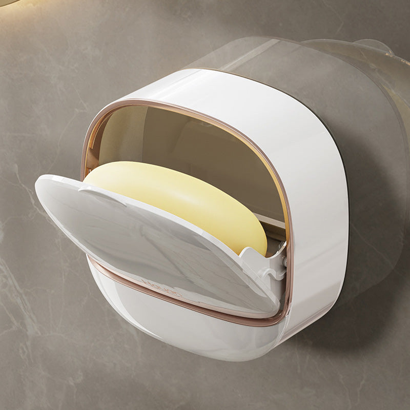 Self-draining soap dish in a minimalist design, a compact bathroom organizer for small spaces, wall-mounted.