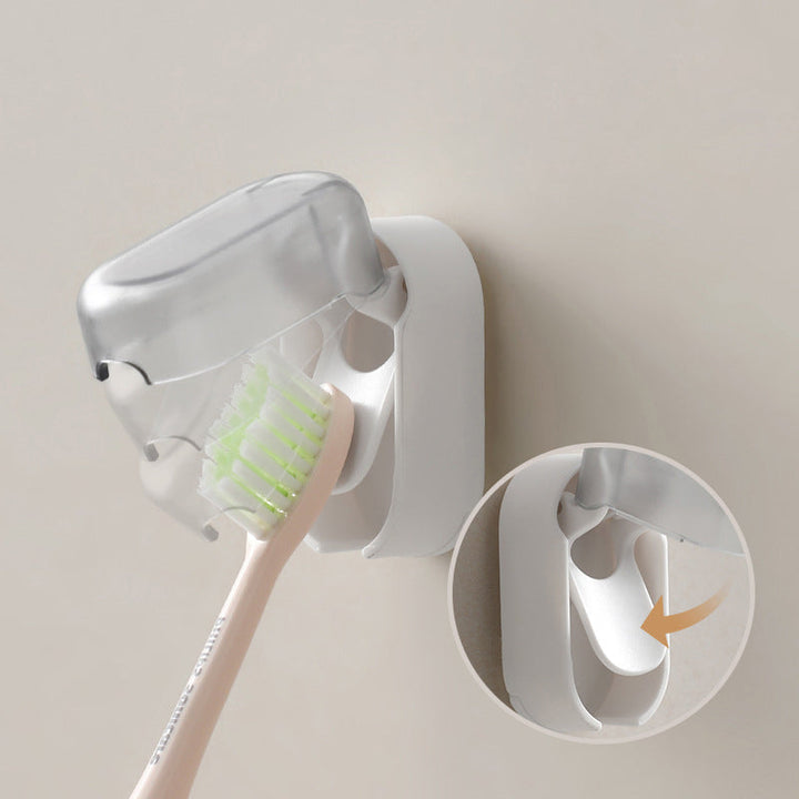 Bathroom wall with adhesive toothbrush holder, cover closed for hygiene