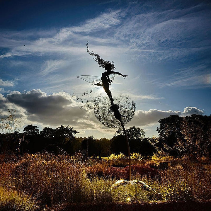 Decorative steel dancing fairy outdoor ornament, whimsical garden statue & metal art for any lawn.