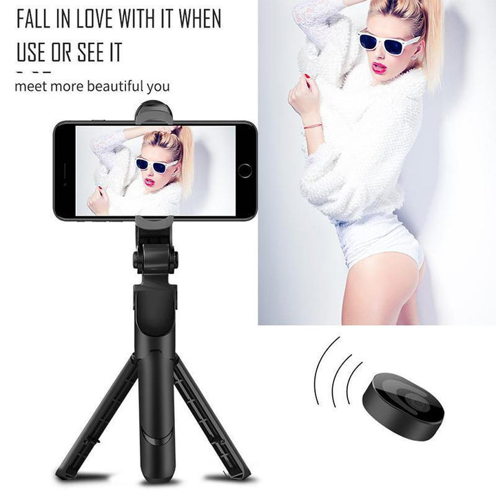 White 3-in-1 selfie stick functioning as a phone tripod, stable on a flat surface