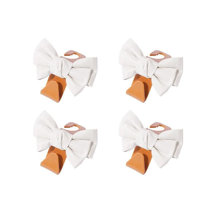 Bowknot design car hooks, perfect for keeping your handbag off the car floor