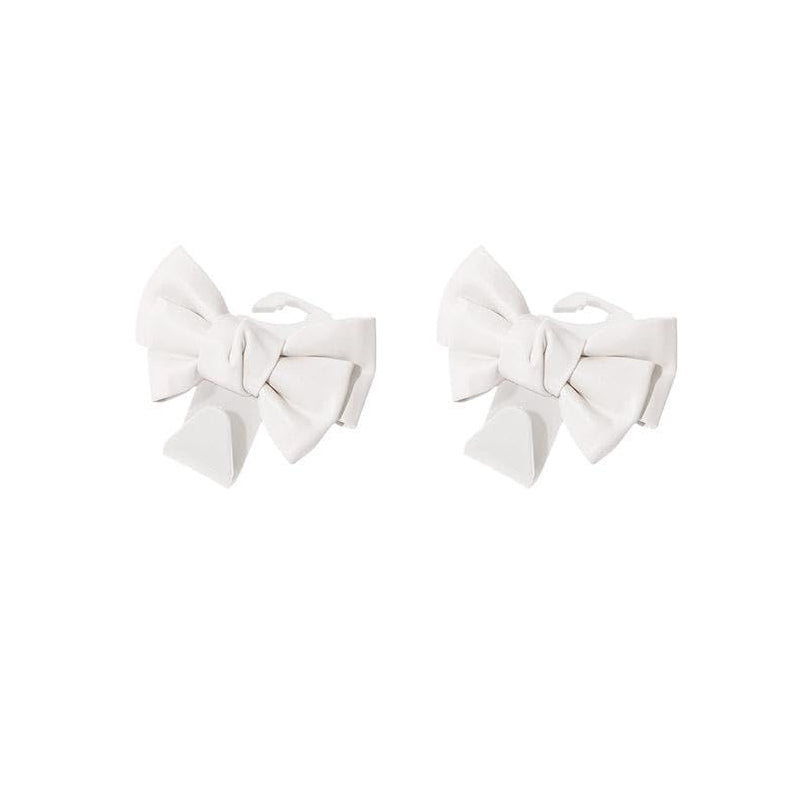 Car interior organized with bowknot design seat back hooks, holding multiple items