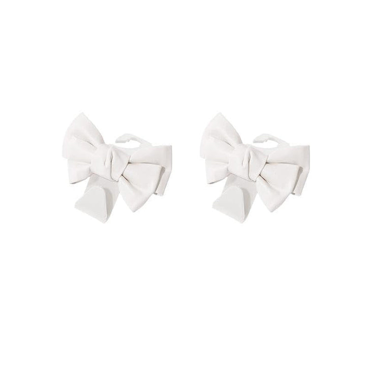 Car interior organized with bowknot design seat back hooks, holding multiple items