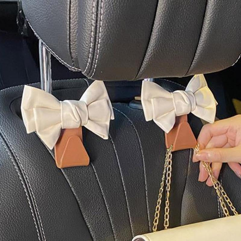 Bowknot car seat hooks in action, keeping car interior tidy and organized