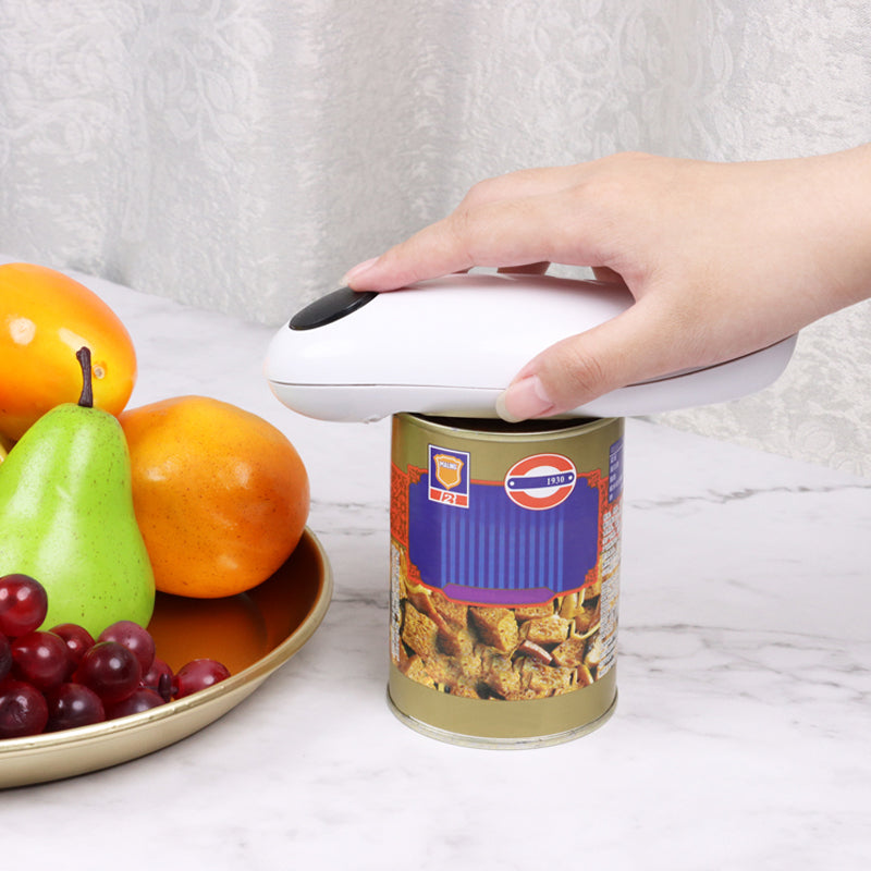 Hand holding electric automatic can opener demonstrating easy open feature for cans and jars