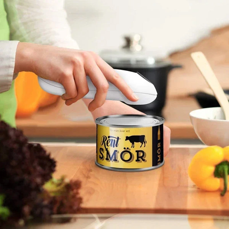 Electric automatic can opener in action, effortlessly opening a standard food can