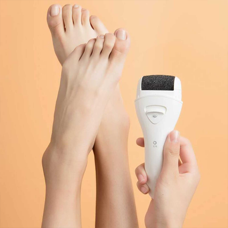Rechargeable electric pedicure tool, displayed with its charging base, essential for foot care