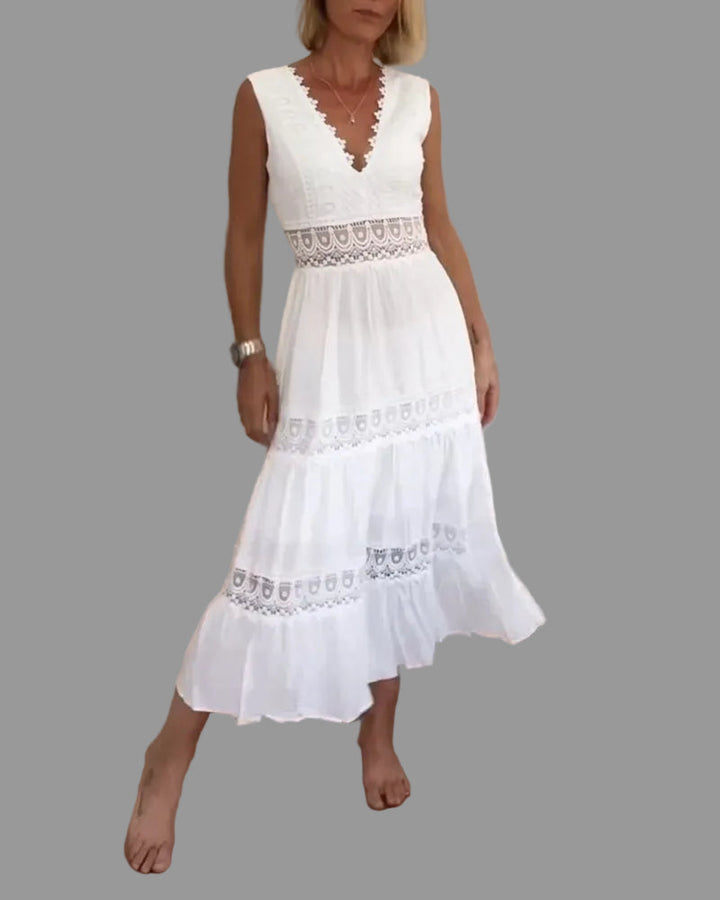 White flowy women's boho chic midi dress with relaxed fit, perfect for summer casual wear or festival fashion.