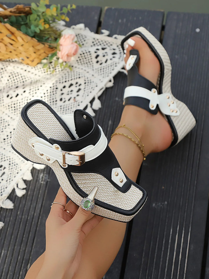 Side view of white platform slides, showing the comfortable sole and adjustable strap for women
