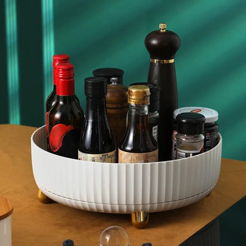 Three rotating storage racks in white, green, and orange, showcasing color options for home organization