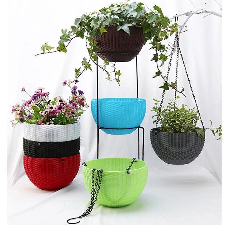 Durable self-watering hanging planter, designed for easy outdoor garden maintenance and plant growth.