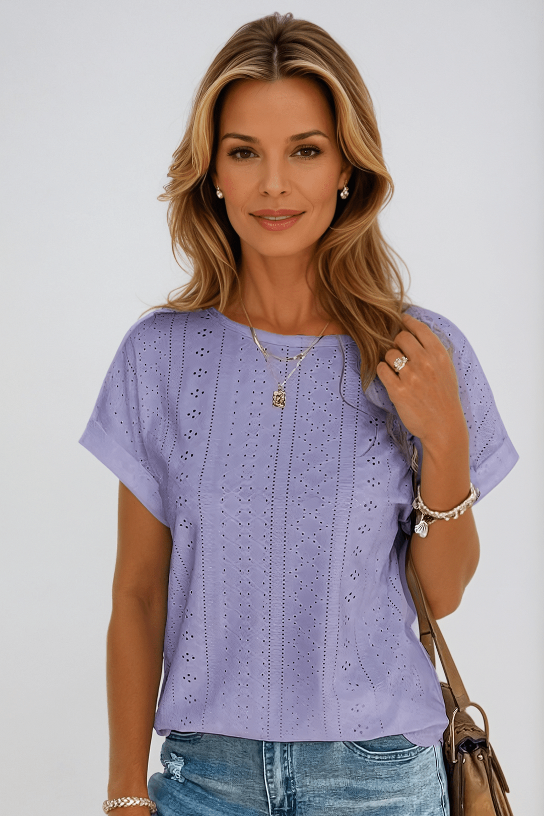 Versatile women's eyelet embroidered top. Crew neck, short sleeve, relaxed fit, perfect for casual summer wear.