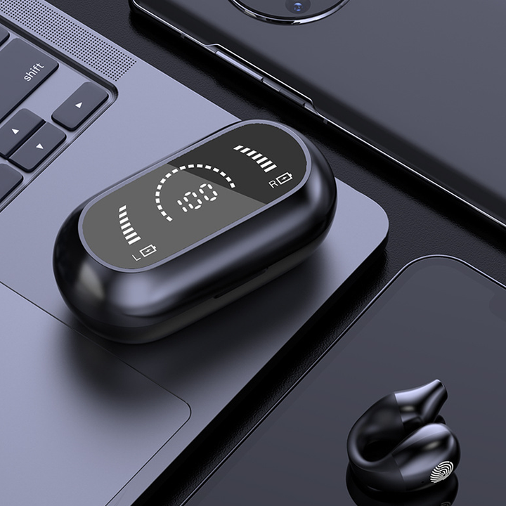 Person wearing bone conduction ear clip headphones while working out, active lifestyle.