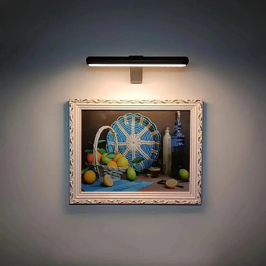 Modern wireless LED picture light enhances art display. Rechargeable, dimmable for stylish home accent & decor.