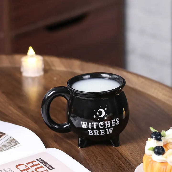 Halloween Witchy Cauldron Mug, black ceramic with a mystical design, ideal for witchcraft enthusiasts