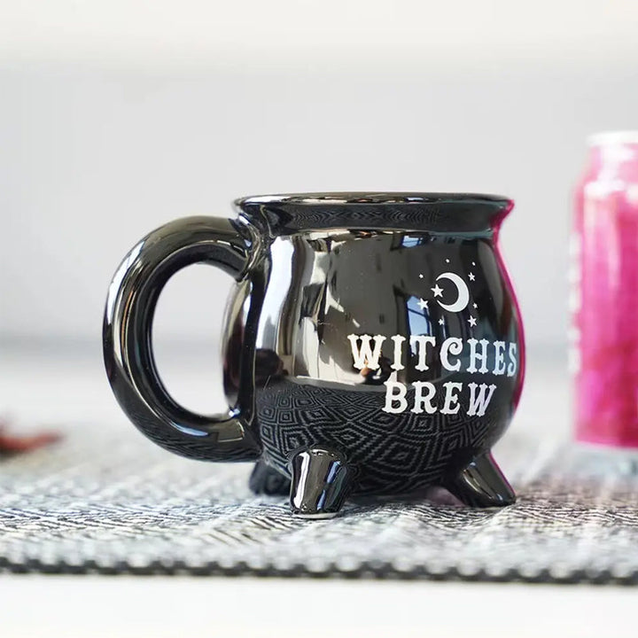 Empty black Witchy Cauldron Mug, ready for your favorite Halloween beverage, with a glossy finish