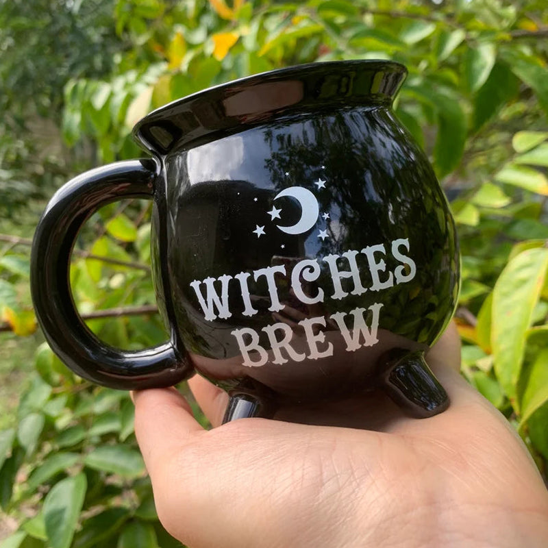 Witchy Cauldron Mug on a rustic wooden table, enhancing the spooky Halloween and witchcraft vibe