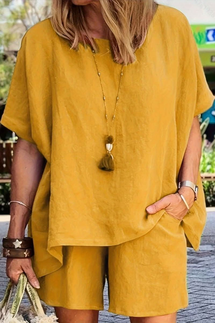 A woman models a comfortable women's relaxed summer co-ord leisure set, ideal for casual and travel outfits.