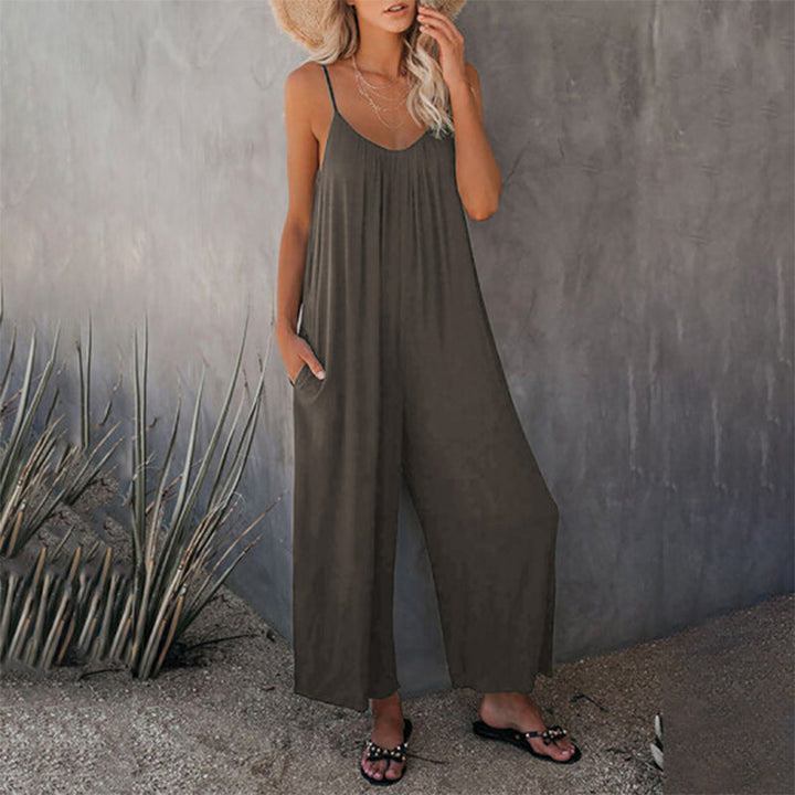 Close-up of the upper bodice of a sleeveless strap jumpsuit, showing the relaxed neck line