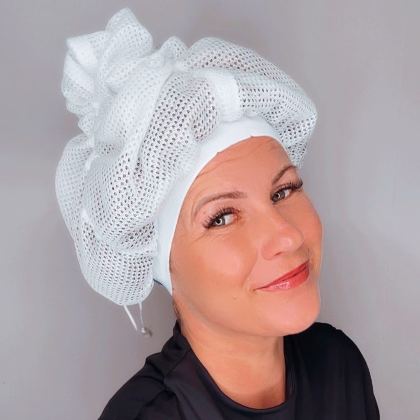 A stack of new hair net plopping caps in different colors, ready for hair care routines