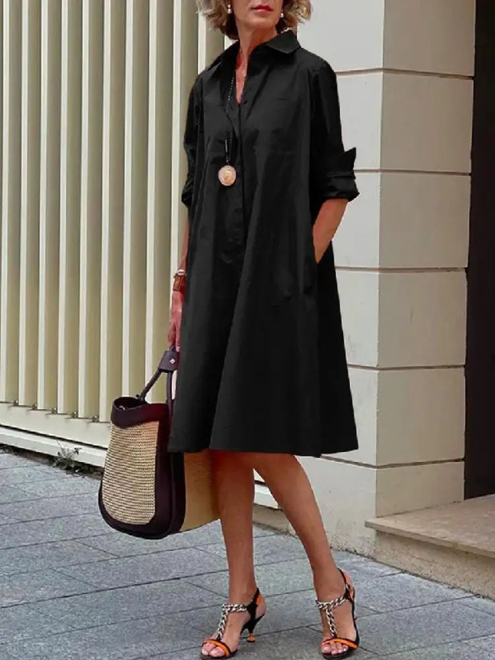 Women's A-line button-front midi shirt dress. Relaxed fit, long sleeve, perfect for casual or work wear. Spring/summer.