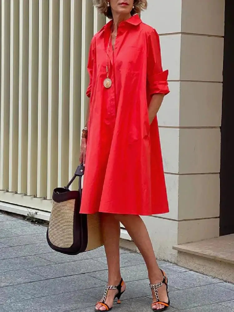 Elegant women's relaxed fit midi shirt dress with button-front. Versatile for everyday wear, spring, and summer fashion.