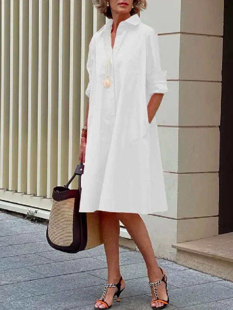 Long sleeve women's button-front A-line midi shirt dress in a comfortable relaxed fit. Ideal casual spring/summer dress.