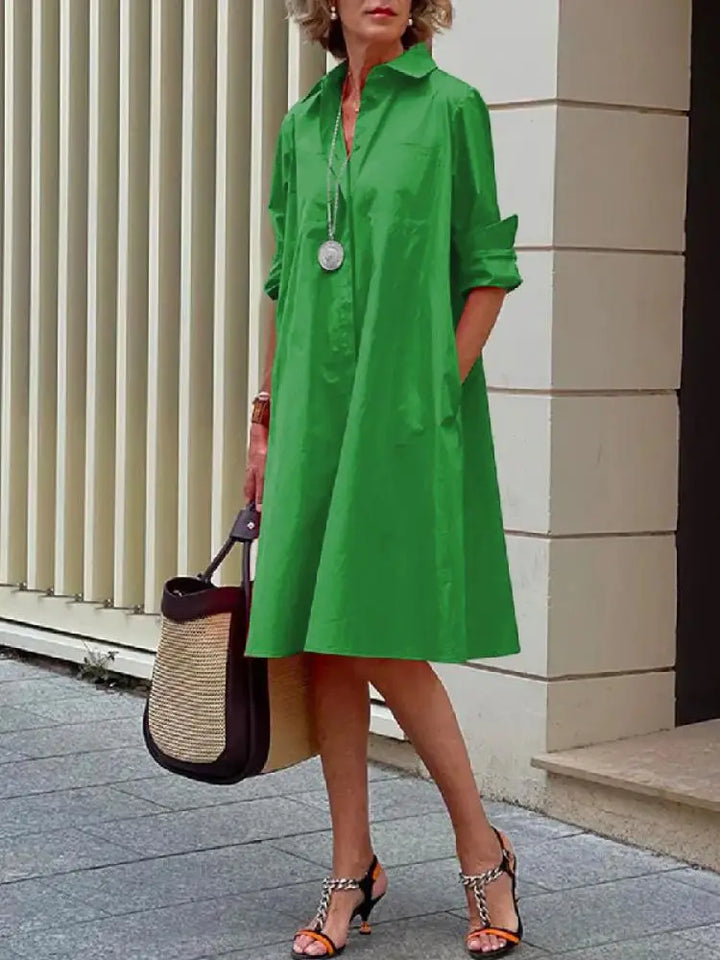 Women's casual button-front A-line midi dress. Relaxed fit, long sleeves, great as a versatile work or summer dress.