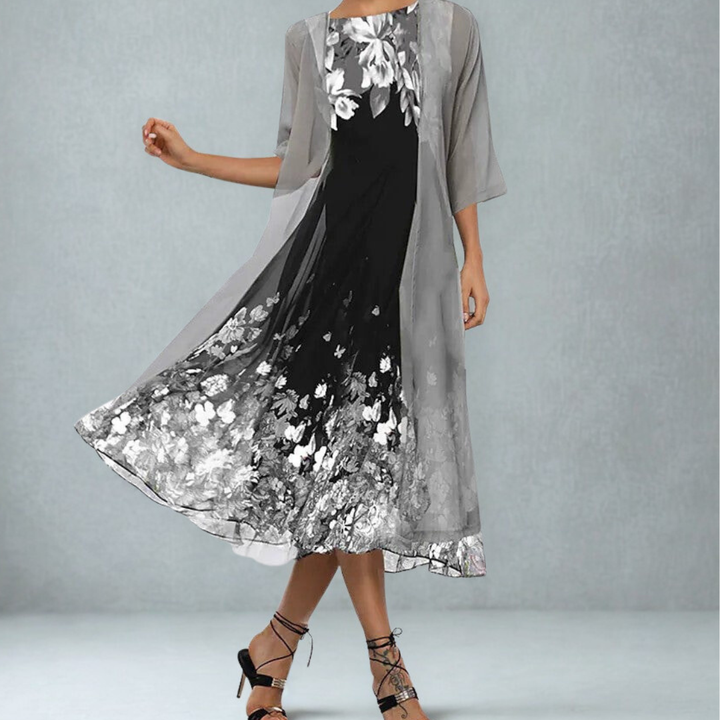 Flattering A-line midi floral dress for women, featuring a flowy skirt & 3/4 sleeves. Versatile for spring/summer.