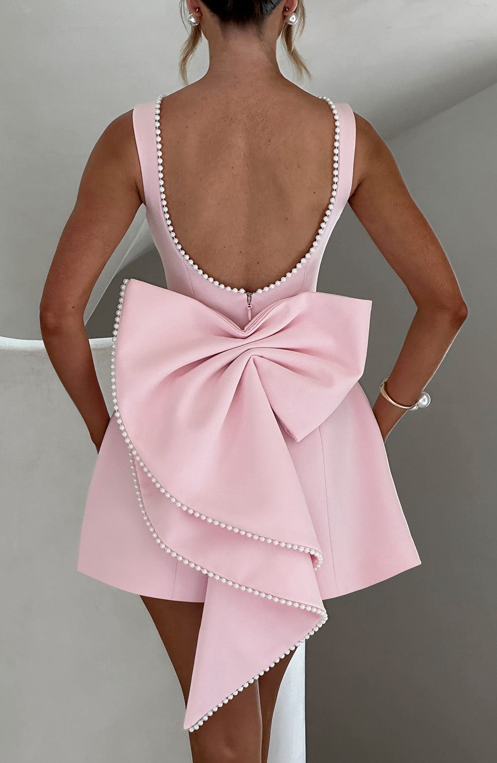 Elegant women's pearl-trimmed A-line mini dress, a sophisticated choice for formal events & cocktails.