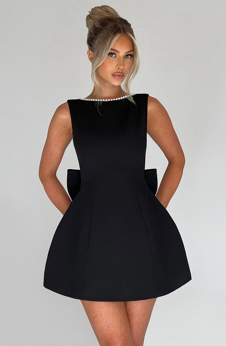 Flattering A-line mini homecoming dress for women, adorned with delicate pearl trim. Ideal for parties.