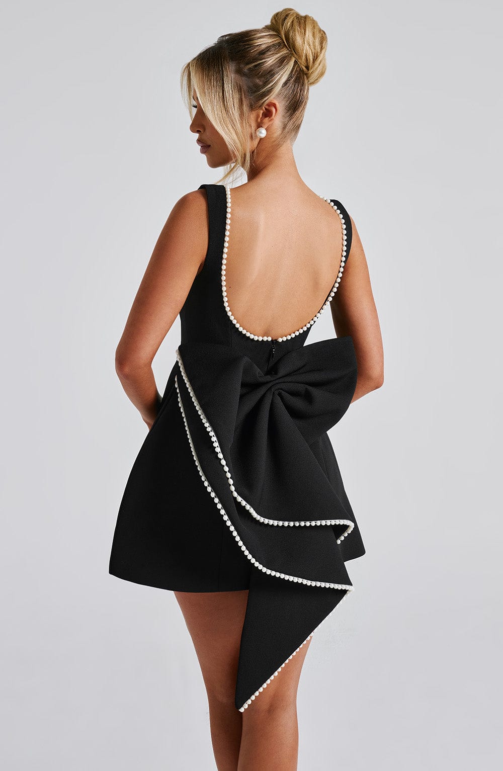 Chic mini A-line dress for women, detailed with exquisite pearl trim. A stunning formal or party dress.