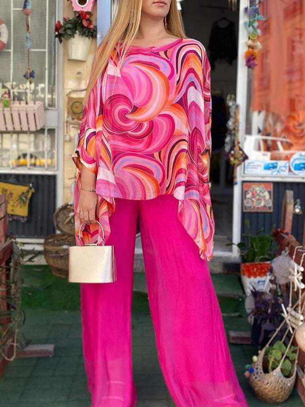 Elegant women's two-piece abstract print set: batwing sleeve top & wide-leg pants. Versatile for casual to resort.