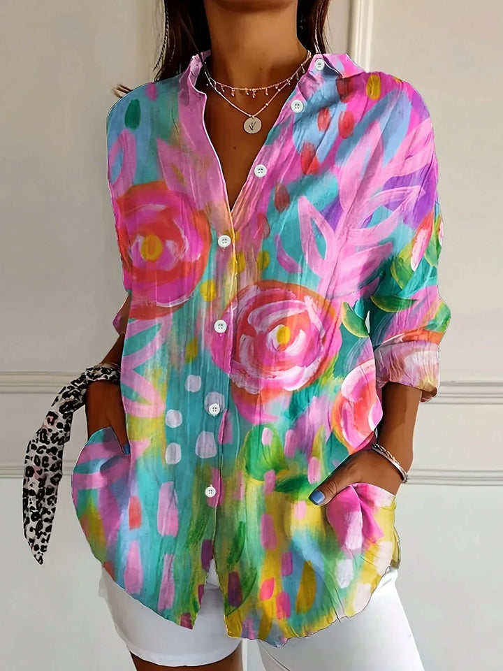 Women's abstract print blouse with button front & long sleeves. Chic, modern style for work or casual wear.