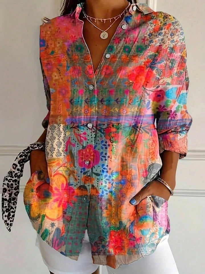 Effortless women's long sleeve blouse in a vibrant abstract print. Versatile top for everyday comfort.