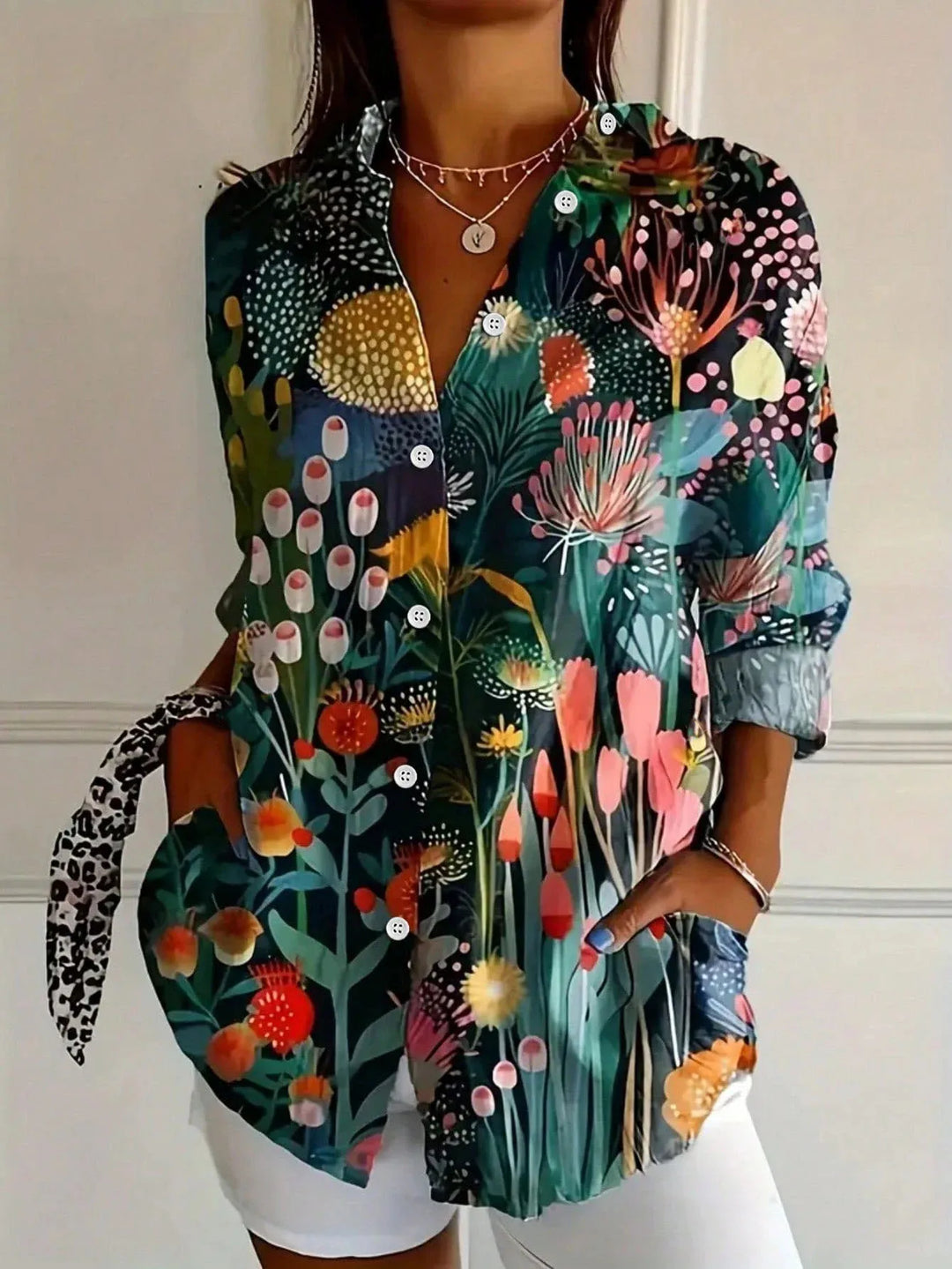 Stylish abstract print button-front blouse for women. A comfortable, modern long sleeve top for any occasion.