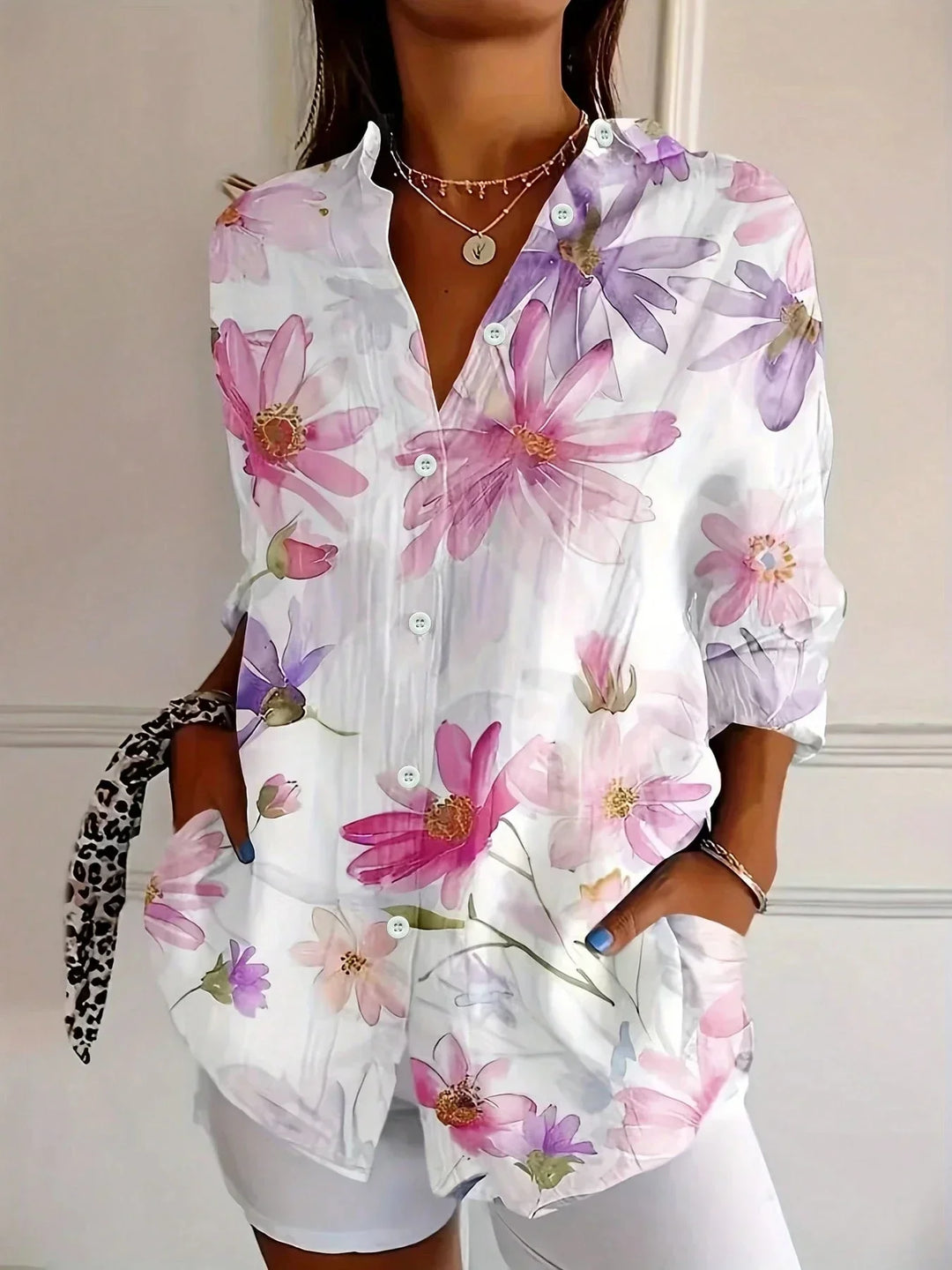 Chic women's blouse featuring an eye-catching abstract print. Long sleeve, button-front design for versatile fashion.