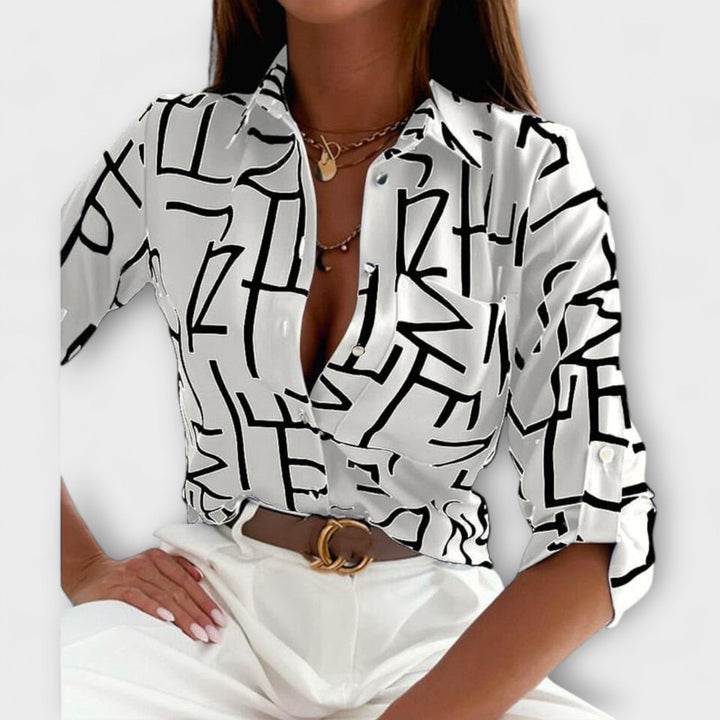 Versatile women's button down blouse, long sleeve abstract print with a handy chest pocket.