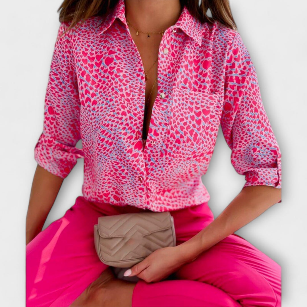 Elegant women's abstract print long sleeve button down blouse with a practical chest pocket.