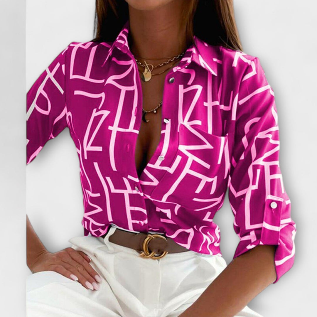 Fashionable women's abstract pattern button down blouse, a stylish oversized fit top.