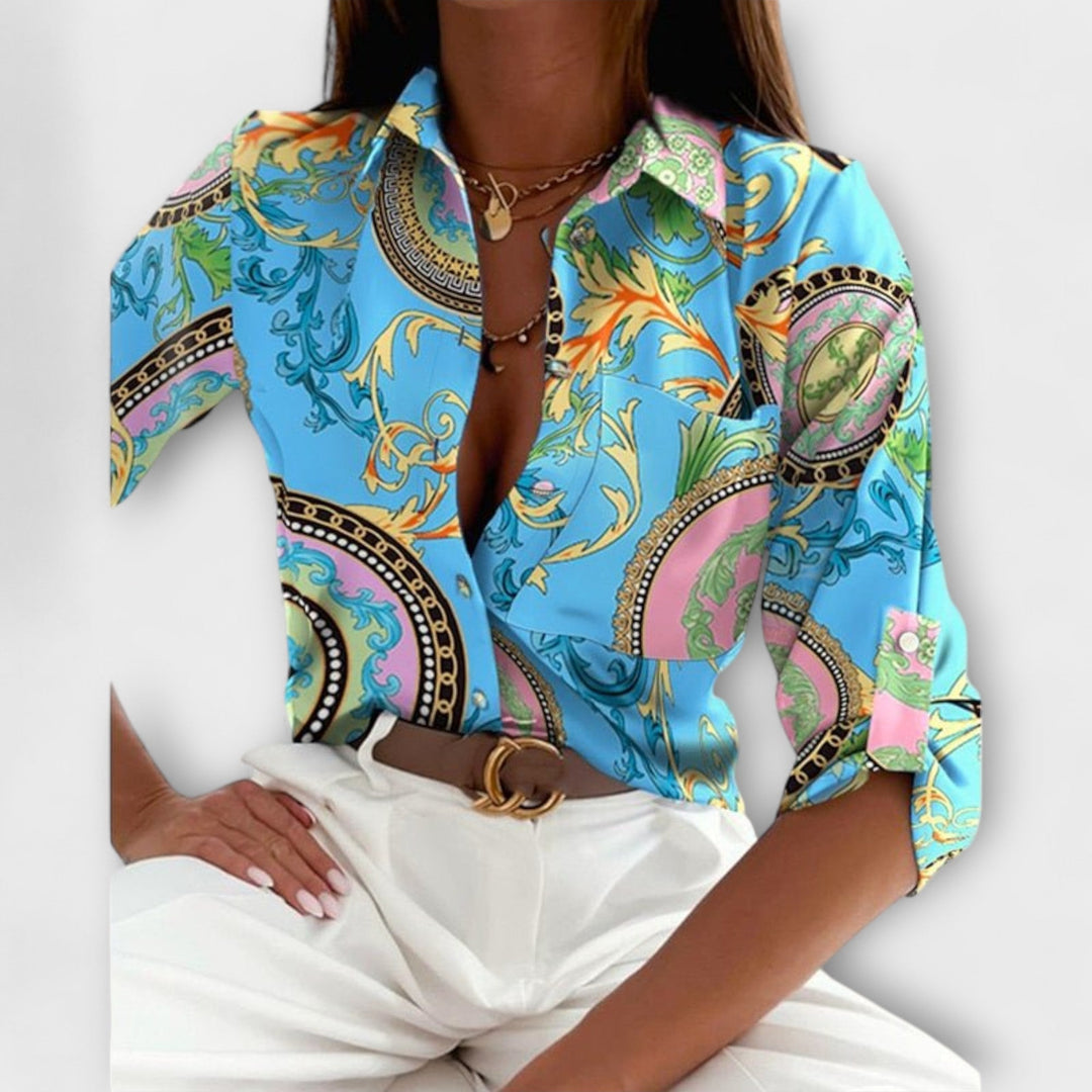 Women's long sleeve button down blouse with a unique abstract print and single chest pocket.