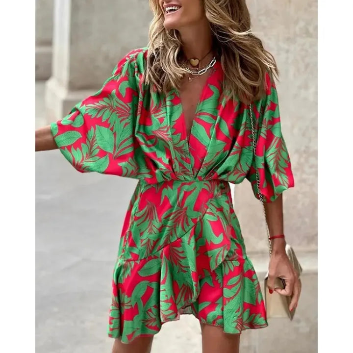 Flowy women's mini dress featuring a vibrant abstract print, flattering V-neck, and stylish ruffles. Ideal for parties.