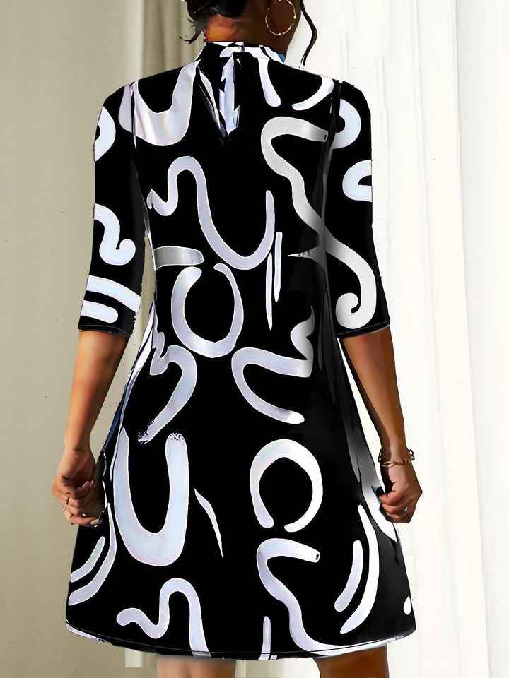 Comfortable women's mock neck dress. Loose-fit, three-quarter sleeve, abstract print for casual summer style.
