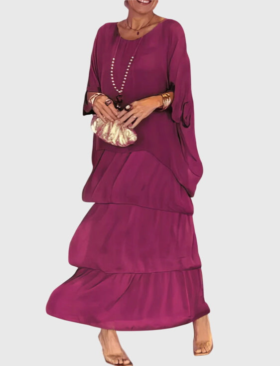 Women's summer tiered maxi dress with an eye-catching abstract pattern, flowy silhouette.