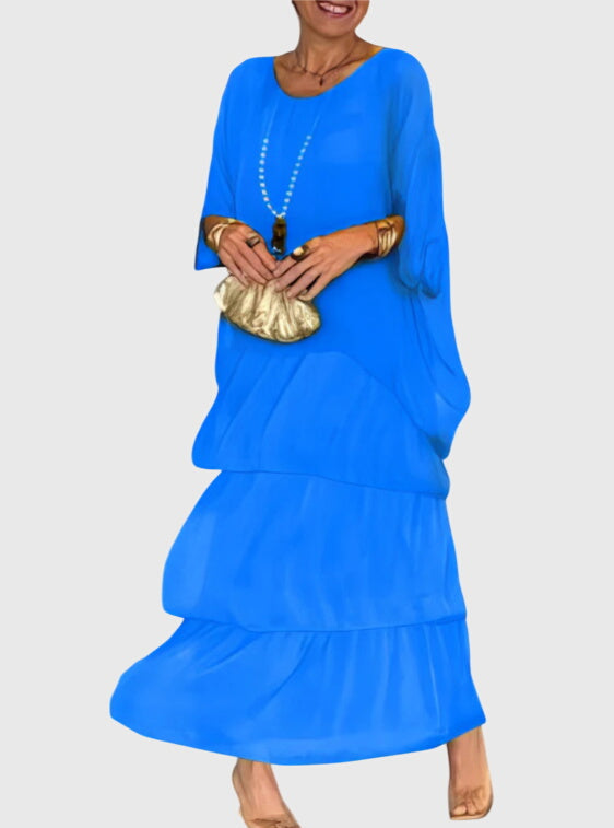 Boho abstract print maxi dress for women, tiered flowy design, perfect for beach vacations.