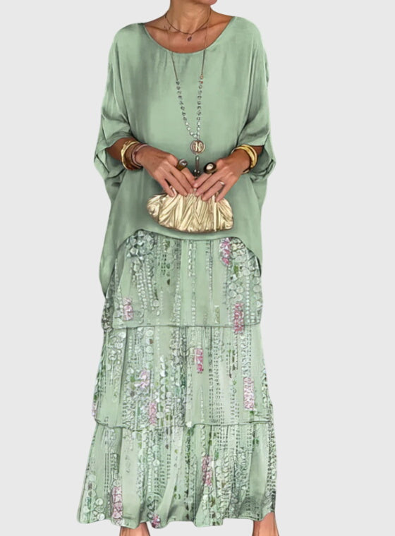 Vibrant abstract print women's tiered maxi dress, flowy and comfortable for summer days.
