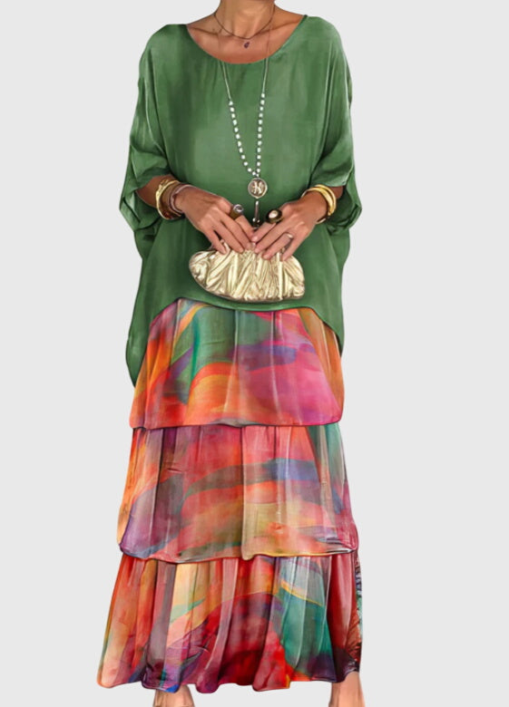 Boho-chic women's maxi dress with abstract print, tiered skirt, perfect for festivals.